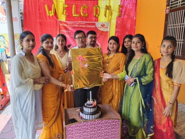 Students gathered around a model volcano