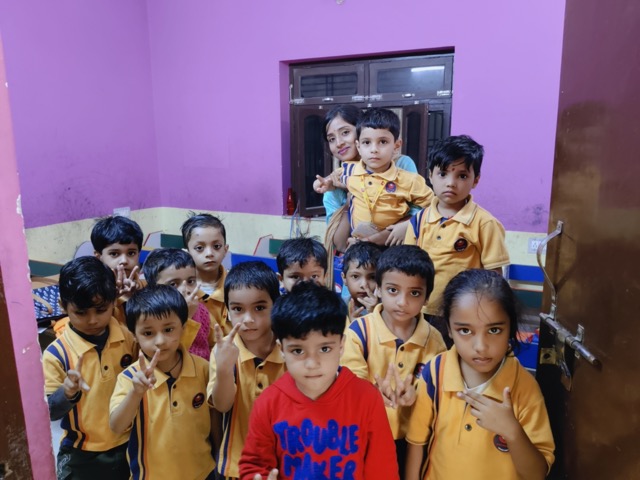 Student receiving a trophy on stage